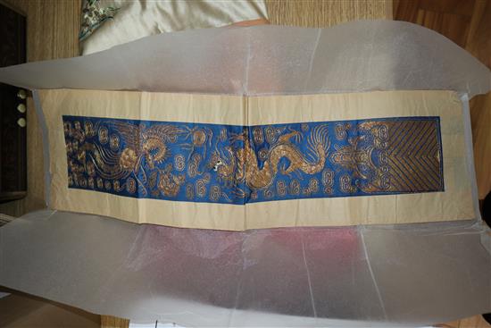 A Chinese silk embroidered hanging and a collection of embroidered sleeve bands and panels
